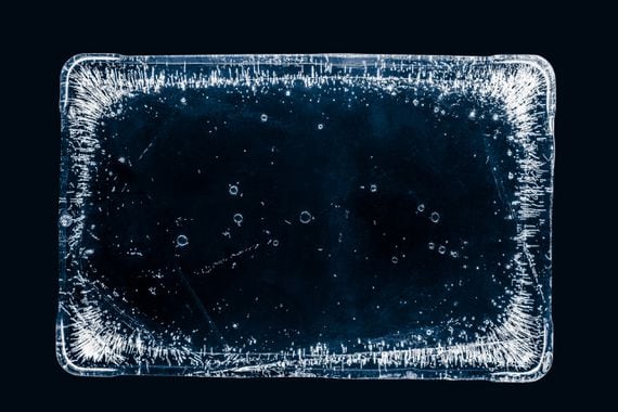 large-rectangle-of-clear-ice-with-air-bubbles-on-black-background-with-clipping-path